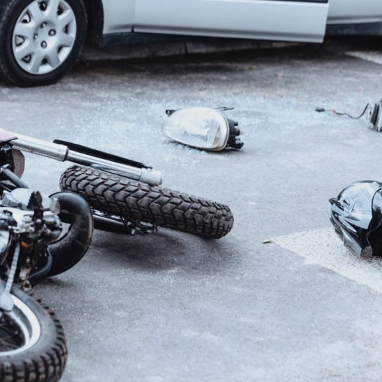 car-mirror-headlight-helmet-and-motorcycle-lying-2025-10-03-02-54-26-utc-w1080-h1920