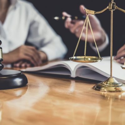 Male lawyer or Counselor working in courtroom have meeting with client are consultation with contract papers of real estate, Law and Legal services concept.